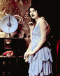 Load image into Gallery viewer, Moody Photograph of a Flapper Woman Listening to a Radio, circa 1920s