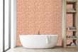 Load image into Gallery viewer, Pink Victorian chintz floral peel and stick wallpaper in bathroom with bathtub