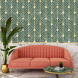 Load image into Gallery viewer, Antique Art Deco green and gold fabric peel and stick wallpaper on wall with pink Art Deco sofa in front of it
