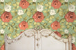 Load image into Gallery viewer, Antique pink and green floral fabric peel and stick wallpaper in room with bed