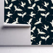 Load image into Gallery viewer, White and blue moody crane bird Chinoiserie fabric peel and stick wallpaper on wall partially rolled up