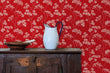 Load image into Gallery viewer, Red antique Victorian floral fabric peel and stick wallpaper in room with cabinet and water pitcher