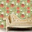 Load image into Gallery viewer, Antique pink and green floral fabric peel and stick wallpaper in room with velvet sofa