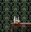 Load image into Gallery viewer, Dark moody Victorian Art Nouveau fabric peel and stick wallpaper in room with table and gold bottles