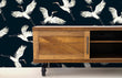 Load image into Gallery viewer, White and blue moody crane bird Chinoiserie fabric peel and stick wallpaper with rolling cabinet