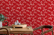 Load image into Gallery viewer, Red antique Victorian floral fabric peel and stick wallpaper in room with dining table and chairs