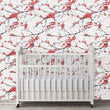Load image into Gallery viewer, Pink Chinoiserie floral cherry blossom botanical fabric peel and stick wallpaper with crib in nursery