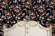 Load image into Gallery viewer, Dark flower garden fabric peel and stick wallpaper with antique bed