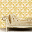 Load image into Gallery viewer, Antique Victorian gold damask fabric peel and stick wallpaper with gold sofa