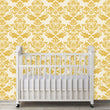 Load image into Gallery viewer, Antique Victorian gold damask fabric peel and stick wallpaper in nursery with crib
