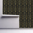 Load image into Gallery viewer, Black and gold geometric antique Art Deco fabric peel and stick wallpaper on wall partially rolled up