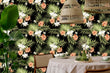 Load image into Gallery viewer, Pink and black dark tropical coastal palm fabric peel and stick wallpaper in dining room with table, chairs and plant