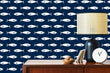 Load image into Gallery viewer, Navy blue and white nautical coastal fish swimming fabric peel and stick wallpaper with cabinet, lamp and clock