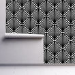 Load image into Gallery viewer, Black and white eclectic geometric Art Deco fabric peel and stick wallpaper on wall partially rolled up