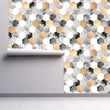 Load image into Gallery viewer, Gold and grey geometric fabric peel and stick wallpaper on wall partially rolled up