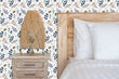 Load image into Gallery viewer, Botanical floral cottage flower garden fabric peel and stick wallpaper in bedroom with bed, table and lamp