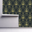 Load image into Gallery viewer, Black and gold vintage antique Art Deco fabric peel and stick wallpaper on wall partially rolled up