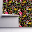 Load image into Gallery viewer, Pink and yellow dark mushroom cottagecore garden fabric peel and stick wallpaper on wall partially rolled up