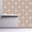 Load image into Gallery viewer, Pink Victorian antique damask fabric peel and stick wallpaper on wall partially rolled up
