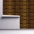 Load image into Gallery viewer, Black and gold Victorian gothic damask fabric peel and stick wallpaper on wall partially rolled up