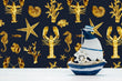 Load image into Gallery viewer, Blue and gold lobster and starfish nautical fabric peel and stick wallpaper with boat decoration