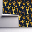 Load image into Gallery viewer, Blue and gold lobster and starfish nautical fabric peel and stick wallpaper on wall partially rolled up