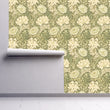 Load image into Gallery viewer, Vintage Art Nouveau floral antique fabric peel and stick wallpaper on wall partially rolled up
