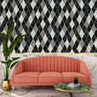 Load image into Gallery viewer, Black and grey vintage Art Deco geometric fabric peel and stick wallpaper with pink sofa, table and plant