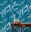 Load image into Gallery viewer, Blue bamboo botanical Asian fabric peel and stick wallpaper with table and gold jars