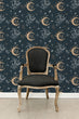 Load image into Gallery viewer, Witchy boho dark moon and stars fabric wallpaper with black chair