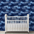 Load image into Gallery viewer, Blue night sky clouds and starts fabric wallpaper with white baby crib