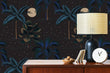 Load image into Gallery viewer, Dark tropical peel and stick wallpaper with wooden cabinet and accent lamp
