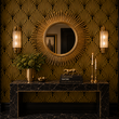 Load image into Gallery viewer, A vintage gold sunburst mirror above a black marble console highlights the striking Hutton Art Deco wallpaper from Pickwick & Elm.