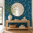 Load image into Gallery viewer, Temple Blue bamboo wallpaper by Pickwick & Elm creates a striking entryway behind a round oak mirror, light wood console table, ceramic vase, and woven basket.