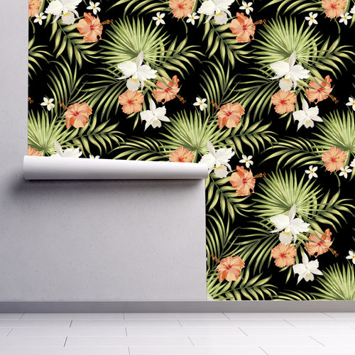 Pink and black dark tropical coastal palm fabric peel and stick wallpaper partially rolled up
