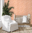 Load image into Gallery viewer, Pink Victorian chintz floral peel and stick wallpaper in nursery with crib and chair

