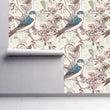 Load image into Gallery viewer, Chinoiseries Victorian bird floral peel and stick wallpaper on wall partially rolled up
