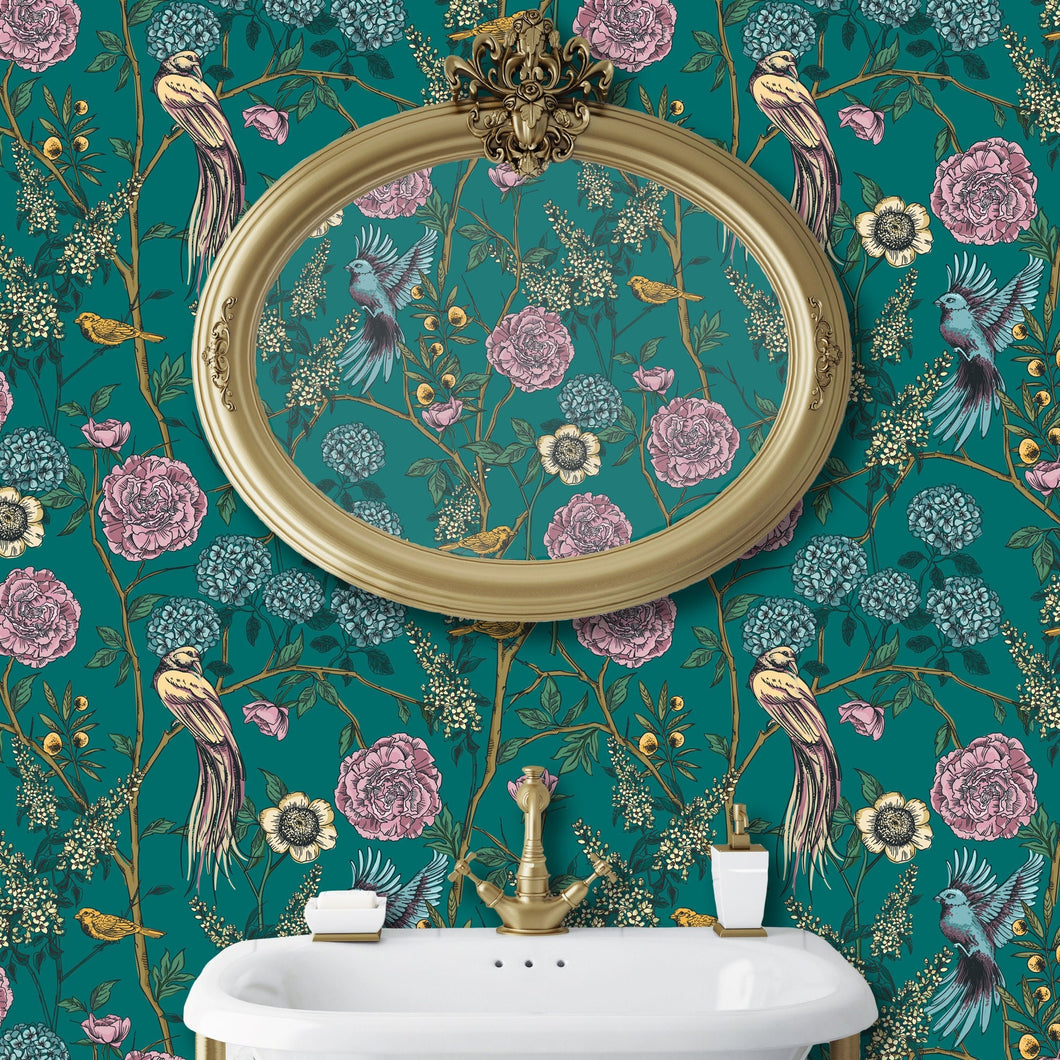 Blue and pink Victorian antique Chinoiserie bird floral fabric peel and stick wallpaper in bathroom with gold mirror and sink