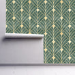 Load image into Gallery viewer, Antique Art Deco green and gold fabric peel and stick wallpaper on wall partially rolled up
