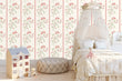 Load image into Gallery viewer, Pink vintage floral fabric peel and stick wallpaper in girl's room with bed and dollhouse
