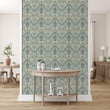 Load image into Gallery viewer, Antique Victorian damask floral grey fabric peel and stick wallpaper with light wood table in front
