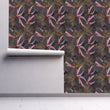 Load image into Gallery viewer, Dark moody tropical leaves fabric peel and stick wallpaper on wall partially rolled up
