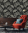 Load image into Gallery viewer, Black and white gothic skull fabric peel and stick wallpaper with red chair, table and cabinet
