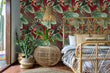 Load image into Gallery viewer, Burgundy and green palm leaves tropical fabric peel and stick wallpaper in room with bed and table and plants
