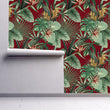 Load image into Gallery viewer, Burgundy and green palm leaves tropical fabric peel and stick wallpaper on wall partially rolled up
