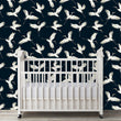 Load image into Gallery viewer, White and blue moody crane bird Chinoiserie fabric peel and stick wallpaper in nursery with crib
