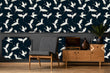 Load image into Gallery viewer, White and blue moody crane bird Chinoiserie fabric peel and stick wallpaper in room with chair, cabinet and plant
