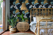 Load image into Gallery viewer, Dark botanical tropical palm leaves fabric peel and stick wallpaper in bedroom with bed, table and plants
