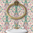Load image into Gallery viewer, Victorian antique pink floral damask fabric peel and stick wallpaper in bathroom with gold mirror and sink
