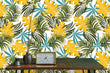 Load image into Gallery viewer, Yellow and blue vintage Mid Century Modern tropical palm leaves fabric peel and stick wallpaper with table and clock
